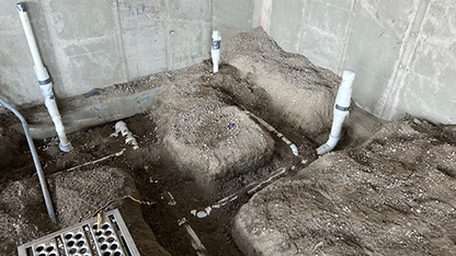 excavation-416x234 Pipes laid in trenches dug under the floor.